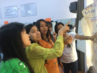 Women looking at a board